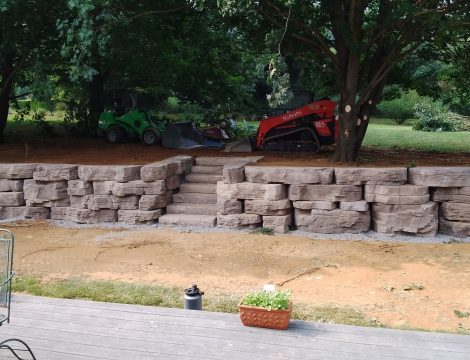 hardscaping walls with steps leading to backyard