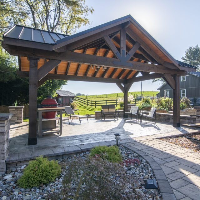 wide angle of pavilion with hardscaped walk way leading under it