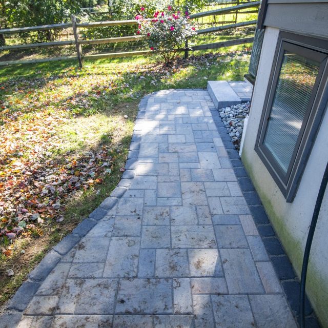 hardscaped patio on side of house