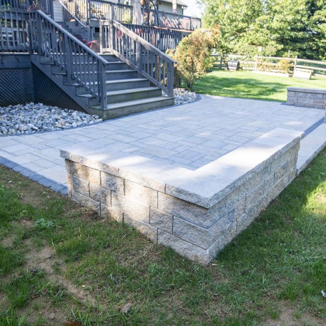 Detail shot of hardscaped patio and patio wall