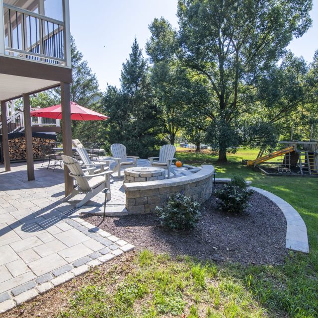 photo from side of the house into back yard view of patio and playset