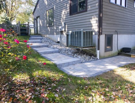 outdoor paver wallway around the side of a home